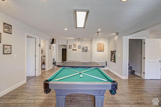 Recreation room with recessed lighting, wood finished floors, baseboards, and billiards | Image 12