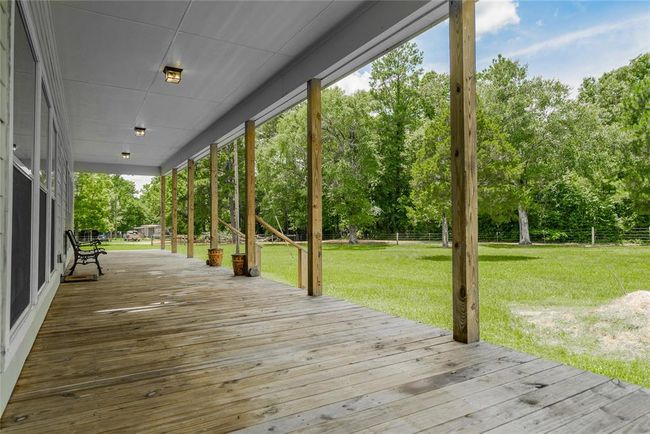 You won't be able to resist these wide porches that surround the home. There is always a breeze and the views are breathtaking. | Image 9
