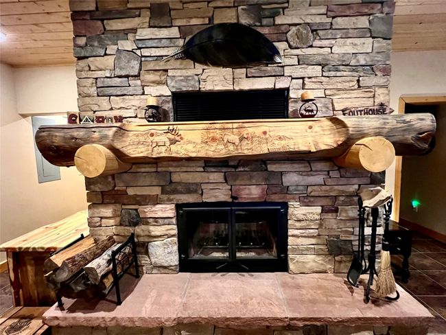 Detailed view of a fireplace and wood ceiling | Image 47