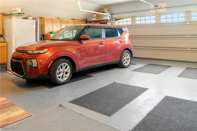 Garage featuring freestanding refrigerator | Image 27