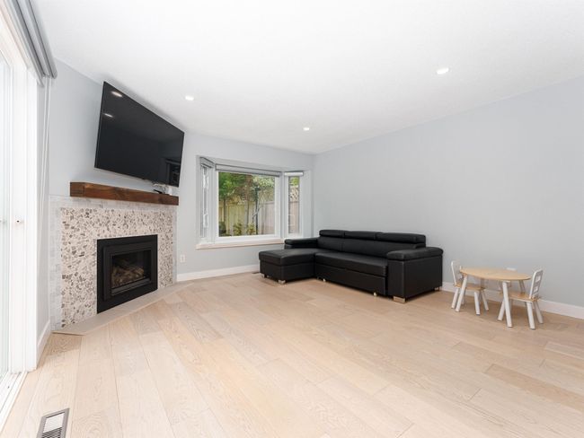 Living room with gas fireplace | Image 11