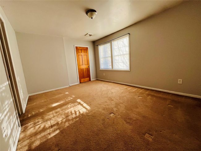 bedroom with full bath and closet | Image 11