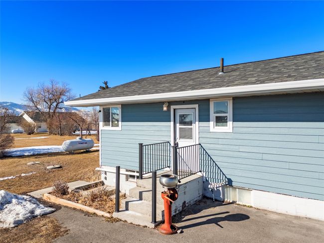Plenty of parking space with a wide concrete driveway | Image 10