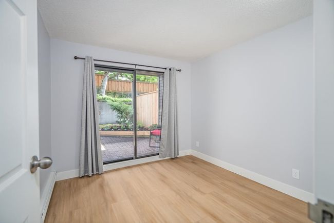 Empty room featuring light wood-style floors and baseboards | Image 14