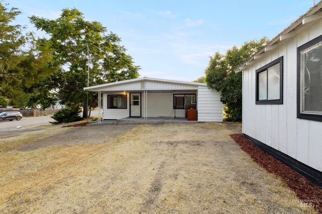 View of home's exterior featuring a porch | Image 4