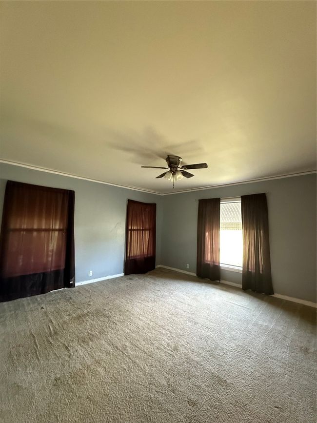 Featuring crown molding, carpet floors, and ceiling fan | Image 9