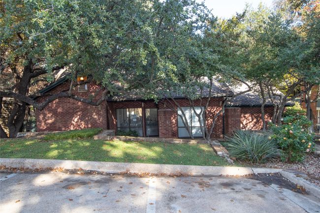 View of front of home with brick siding and a front lawn | Image 4