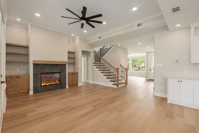 Living room with built-in's and fireplace | Image 5