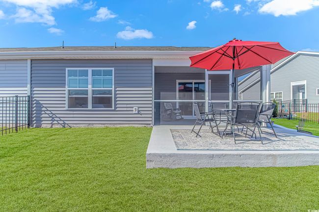 Rear view of house featuring a yard and a patio | Image 22