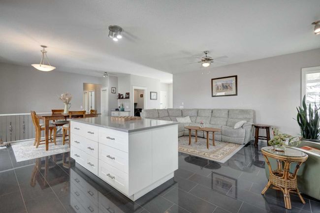 104 1 Avenue Se, Home with 5 bedrooms, 3 bathrooms and 4 parking in Langdon AB | Image 5