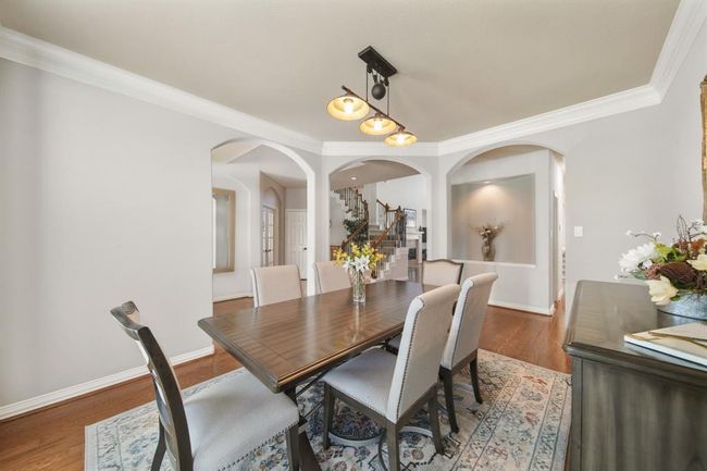 Perfect for casual to formal gatherings, this is a view of the dining room with the foyer in the background. | Image 7