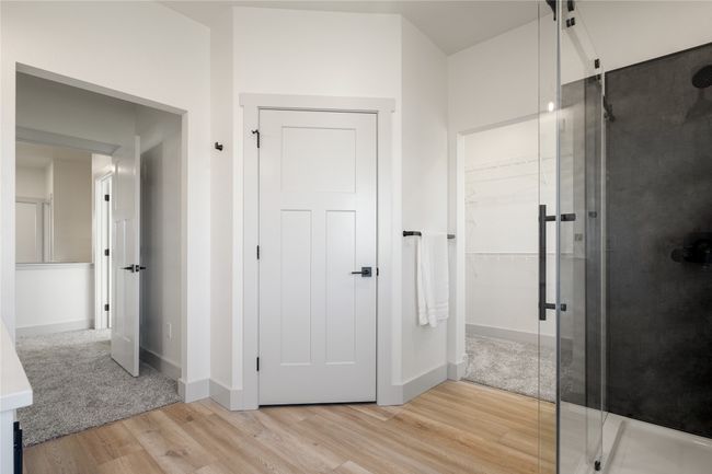 Full bath with wood finished floors, a shower stall, and a spacious closet | Image 38