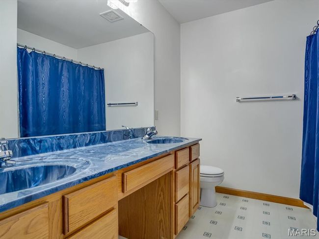 Bathroom with toilet and double vanity | Image 23
