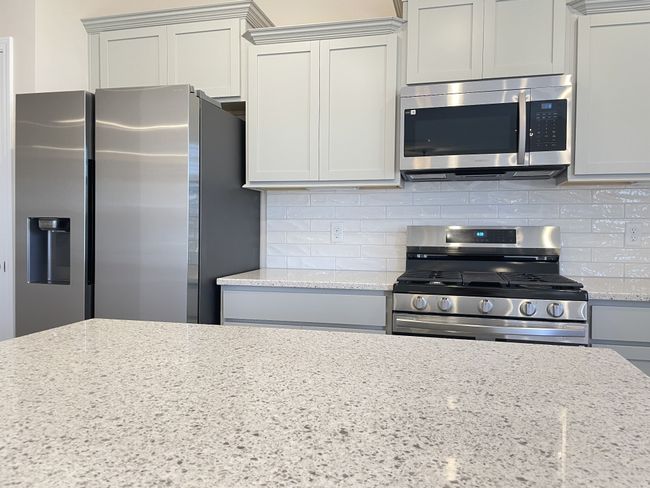 Gas range with side-by-side stainless steel refrigerator | Image 7