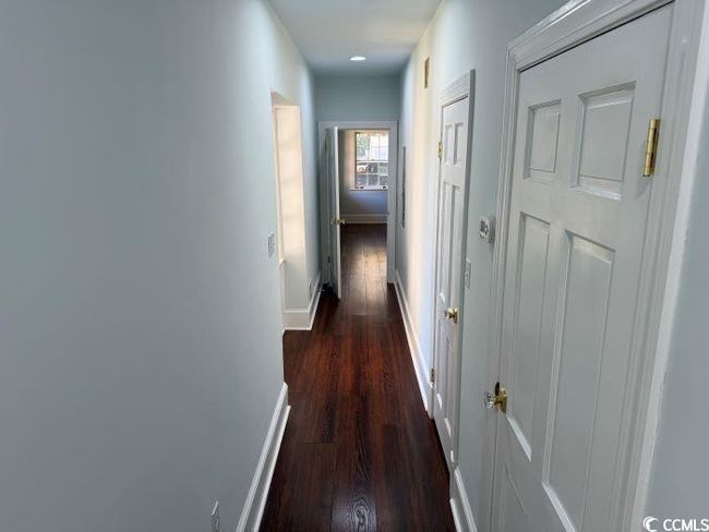 Hallway featuring dark wood-type flooring | Image 16