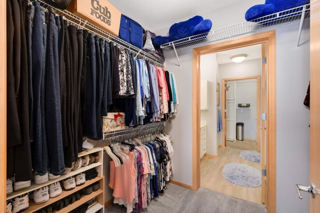 The view from the walk-in closet to the bathroom and laundry room. | Image 14
