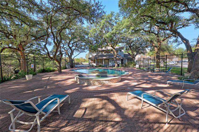 Community pool with a patio area | Image 15