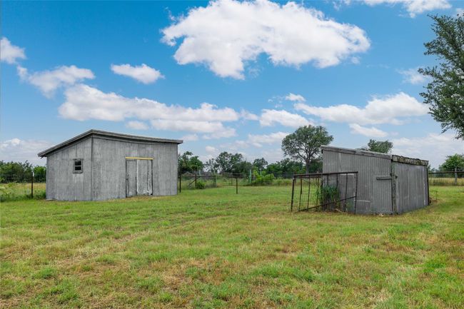 View of yard with an outbuilding | Image 28