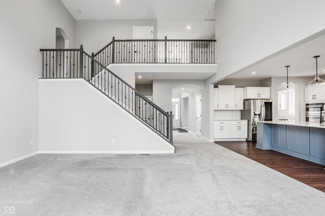 Looking from the great room to the stairs, entry hall and kitchen. | Image 11