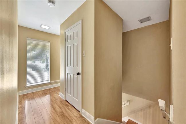 Upstairs you'll find a split plan that offers lots of privacy for the primary bedroom suite. | Image 29