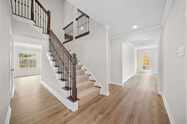 From the foyer entry, study to the right, kitchen to the left and stairs to the 4 bedrooms up | Image 4