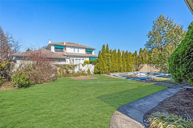 View of yard with a fenced backyard and a fenced in pool | Image 22