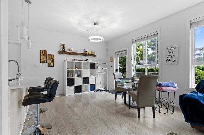 Dining area with light wood finished floors | Image 36