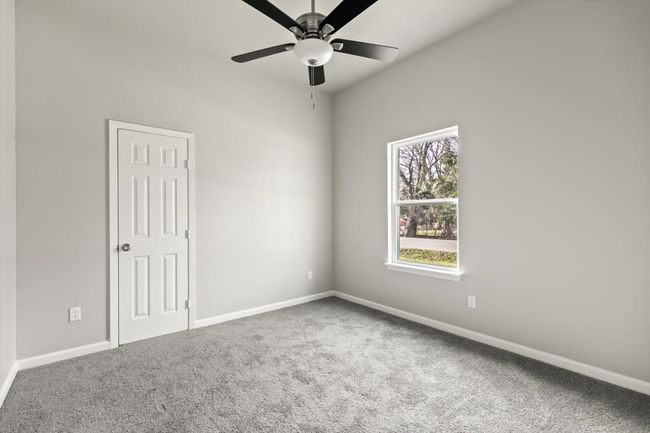 Bedroom featuring lush carpet and ceiling fan | Image 21