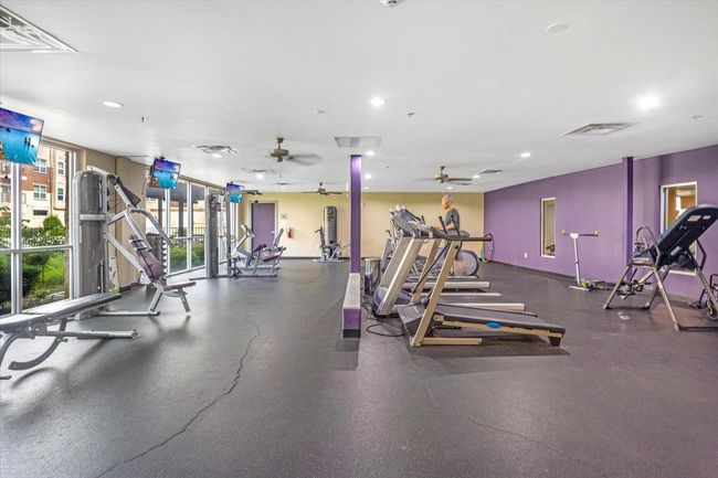 Workout area featuring recessed lighting and a ceiling fan | Image 9
