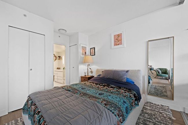 Bedroom with wood finished floors | Image 15