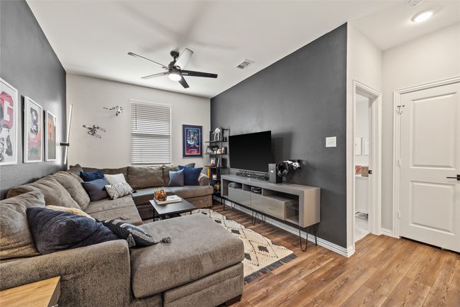 Gameroom With Ceiling Fan and Premium Vinyl Flooring. | Image 14