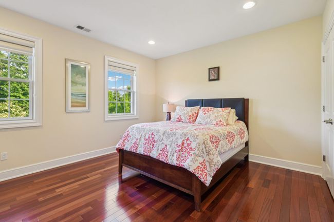 Bedroom featuring multiple windows, Braziian flooring, and recessed lighting | Image 26