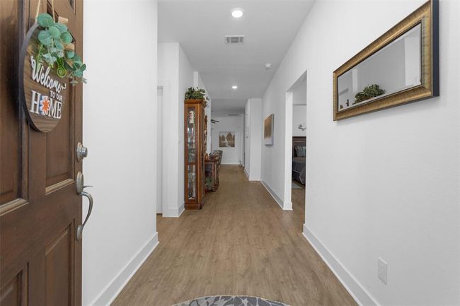 Step into a warm and inviting foyer with sleek finishes and thoughtful design that sets the tone for the rest of the home. | Image 6