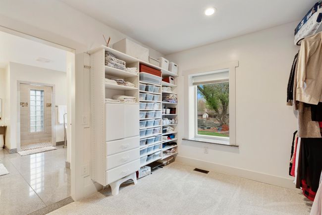 There is no shortage of space and storage in the primary walk-in closet | Image 26