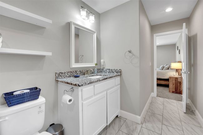 Half bath with toilet, marble finish floor, and baseboards | Image 24