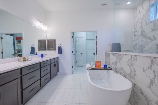 Dual vanities, tile flooring, and lots of cabinet space. | Image 20