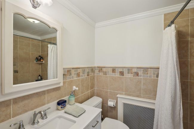 Bedroom featuring ornamental molding and wood finished floors | Image 22