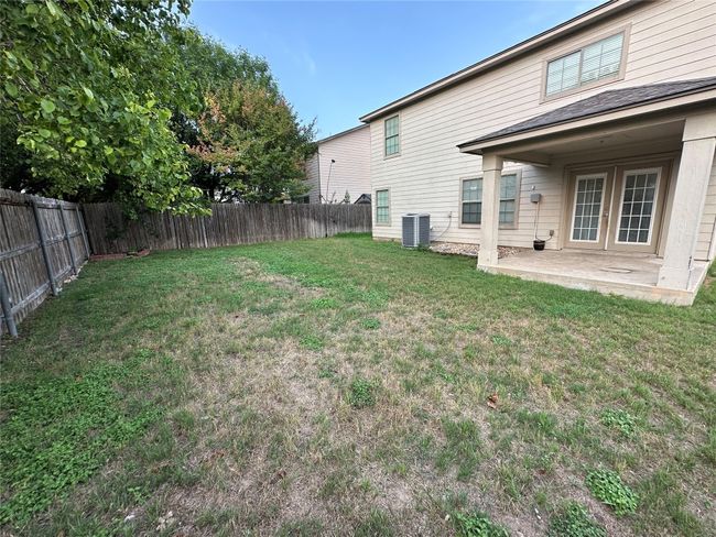 Fenced backyard with a patio and french doors | Image 40