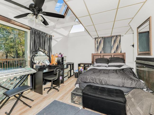 Lower level bonus room with walk-out to yard in use as a 5th bedroom | Image 20