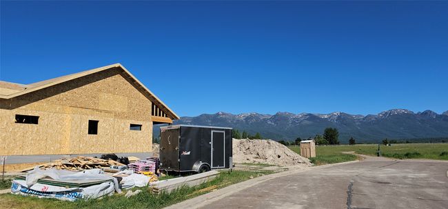 View of street featuring a mountain view and curbs | Image 24