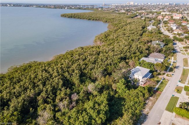 Birds eye view of property with a water view and a wooded view | Image 8
