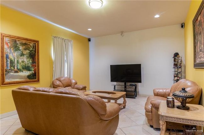 Living room with light tile patterned flooring | Image 19