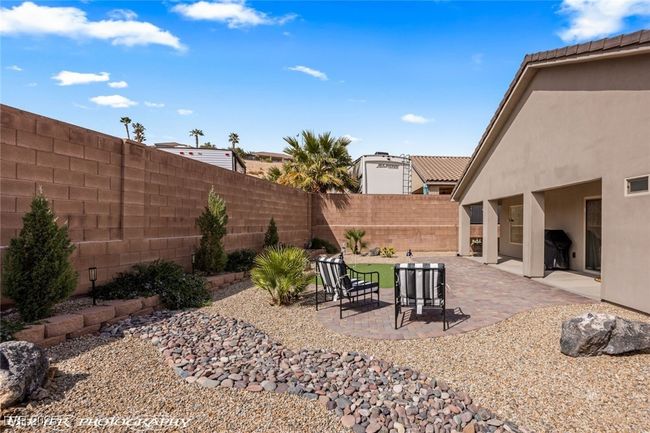Fenced backyard featuring a patio area | Image 52