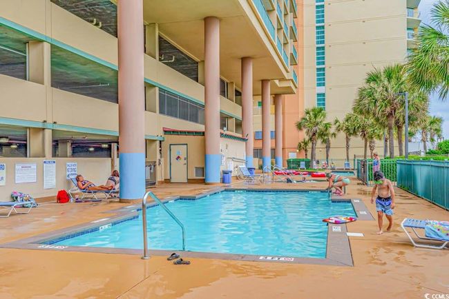 View of pool with a patio | Image 34