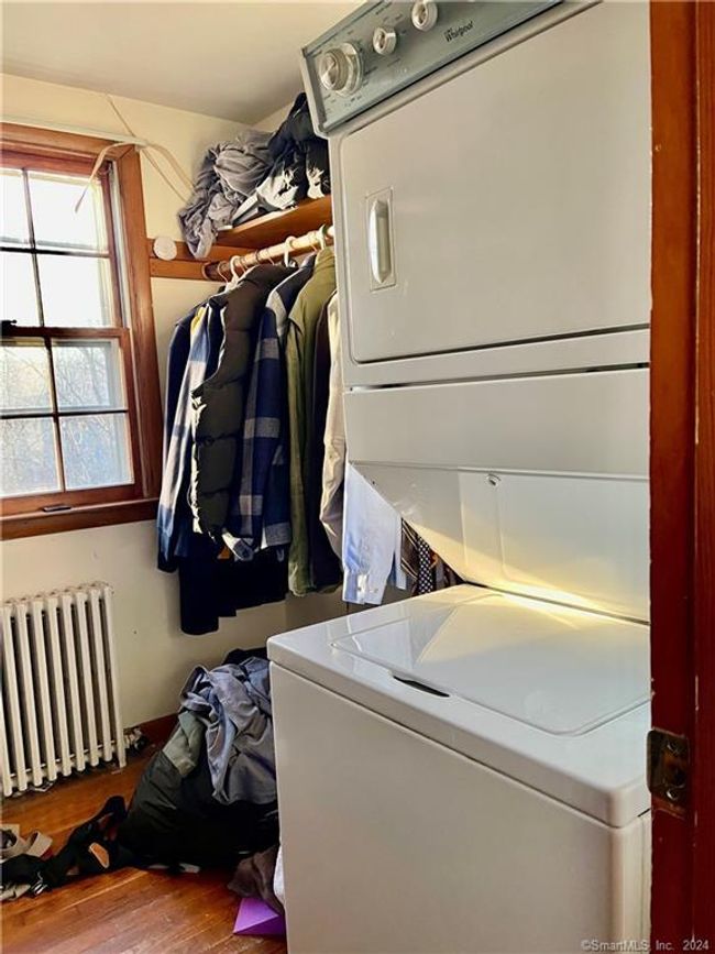 Walk-in Closet with Stackable Washer &amp; Dryer in Apartment | Image 26