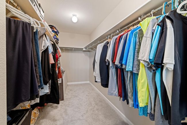 The spacious walk-in closet in the primary suite offers ample storage and organization potential. | Image 21