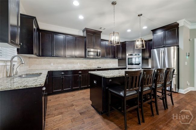 Loads of counter space, island and cabinetry. | Image 16