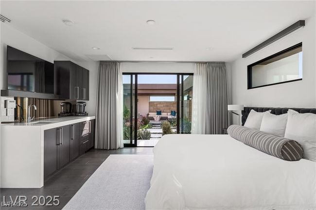 Bedroom with dark wood-style flooring and a sink | Image 41