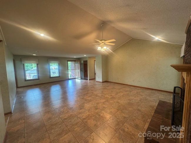 view from sunroom to living area | Image 10