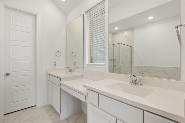 Full bath featuring marble finish floor, double vanity, a marble finish shower, recessed lighting, and a sink | Image 21